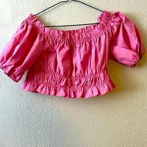 Pink and elegant top. Simple of good quality and new. Never worn.